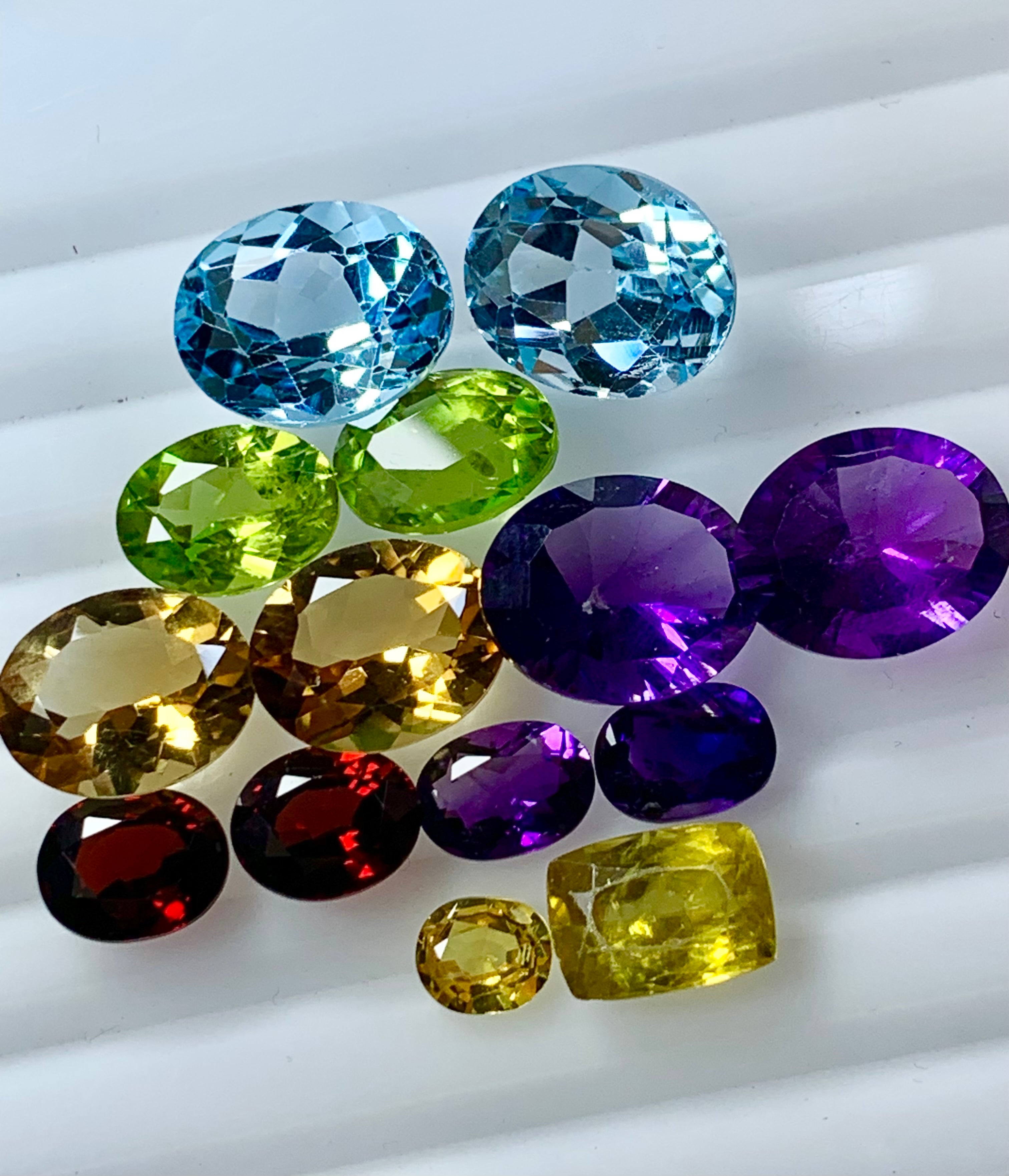 multi colored gemstones on a white background