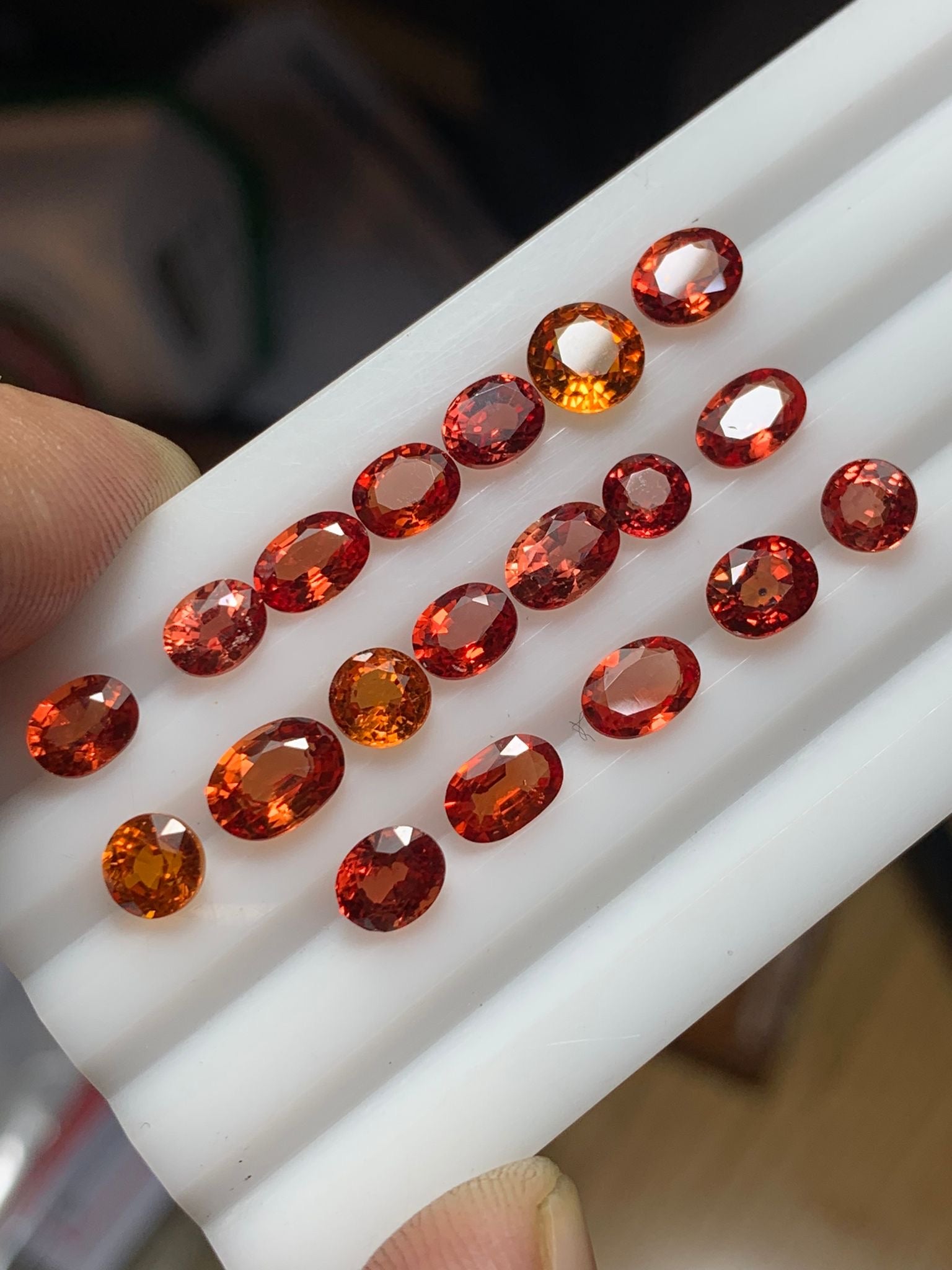 faceted orangish red sapphire