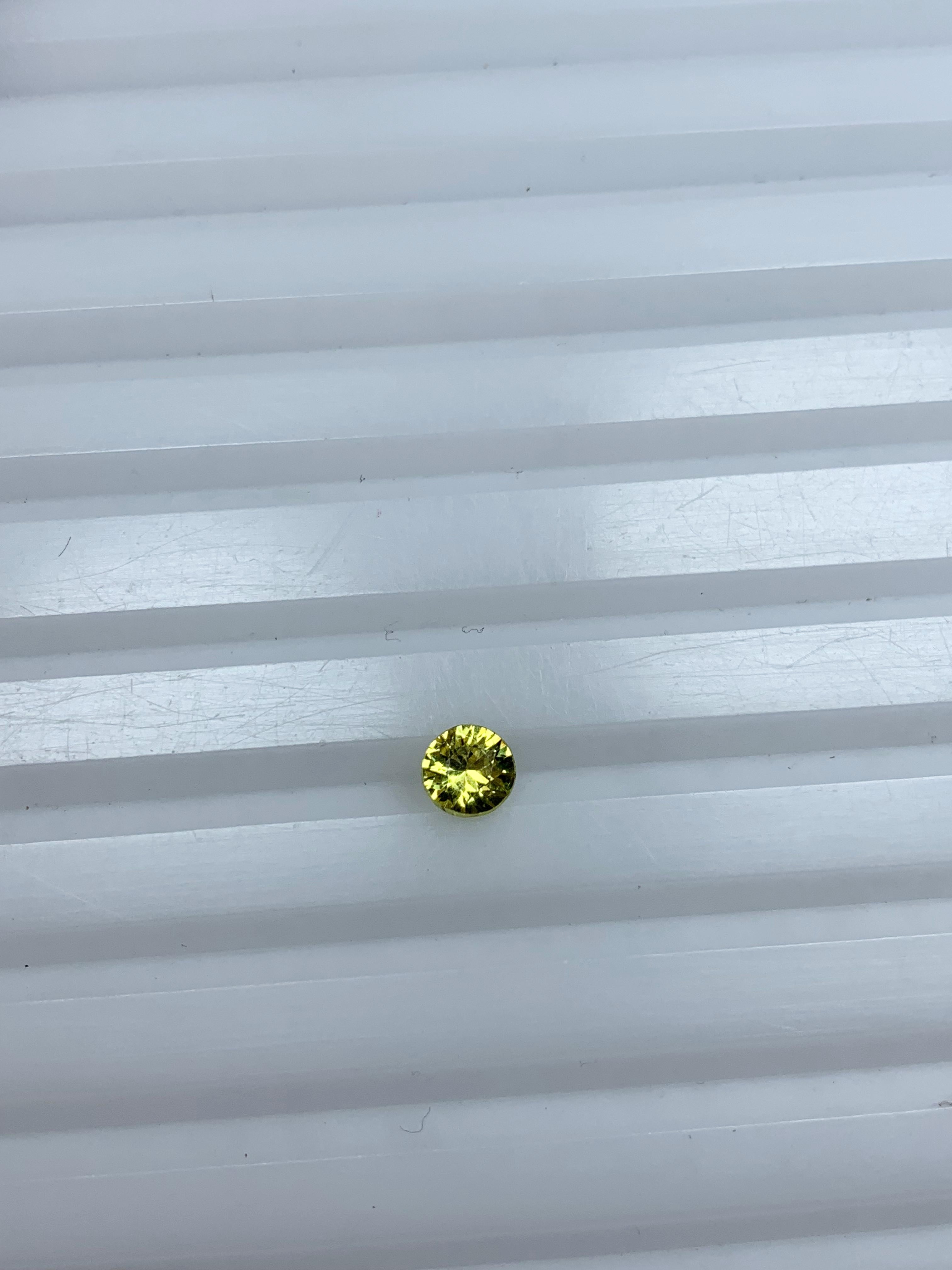 Pukhraj yellow sapphire 0.50 carat round cut
