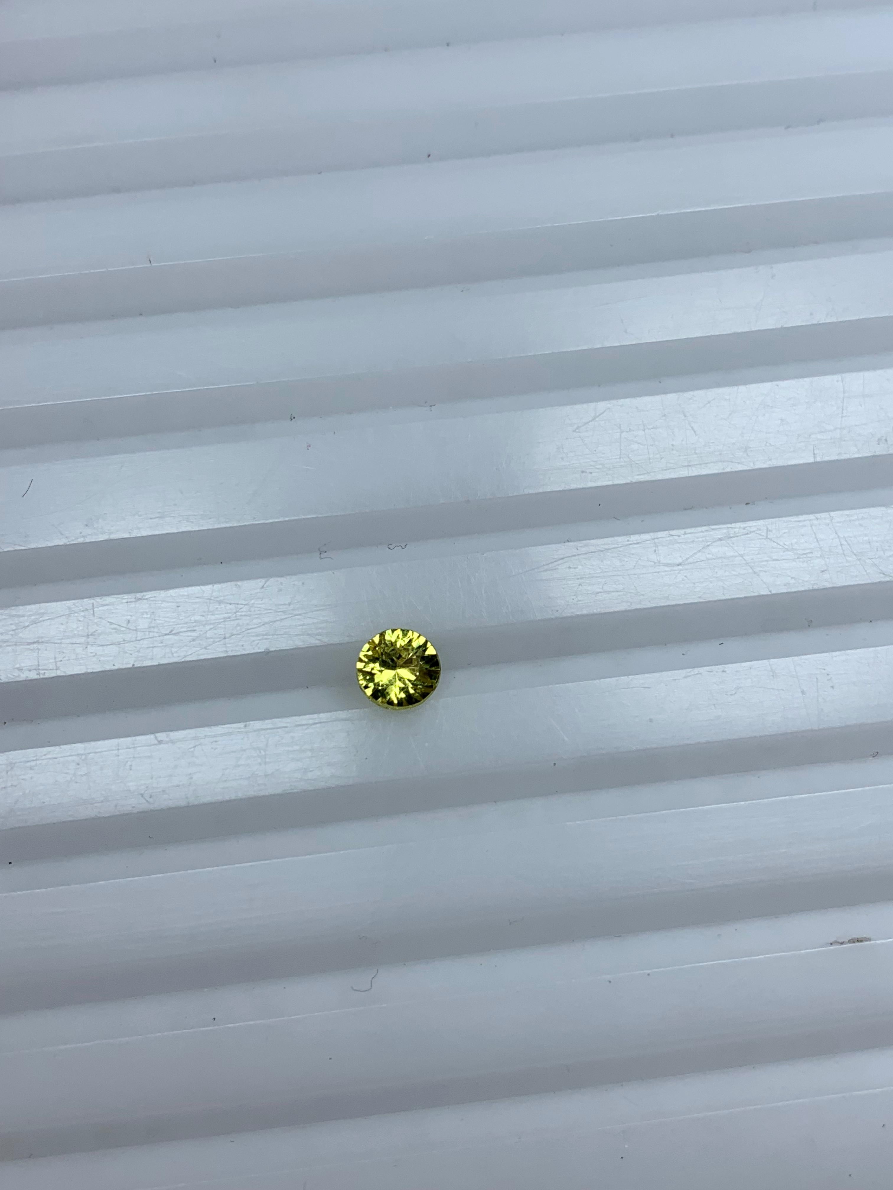 Lemon yellow sapphire 0.50 carat round gem
