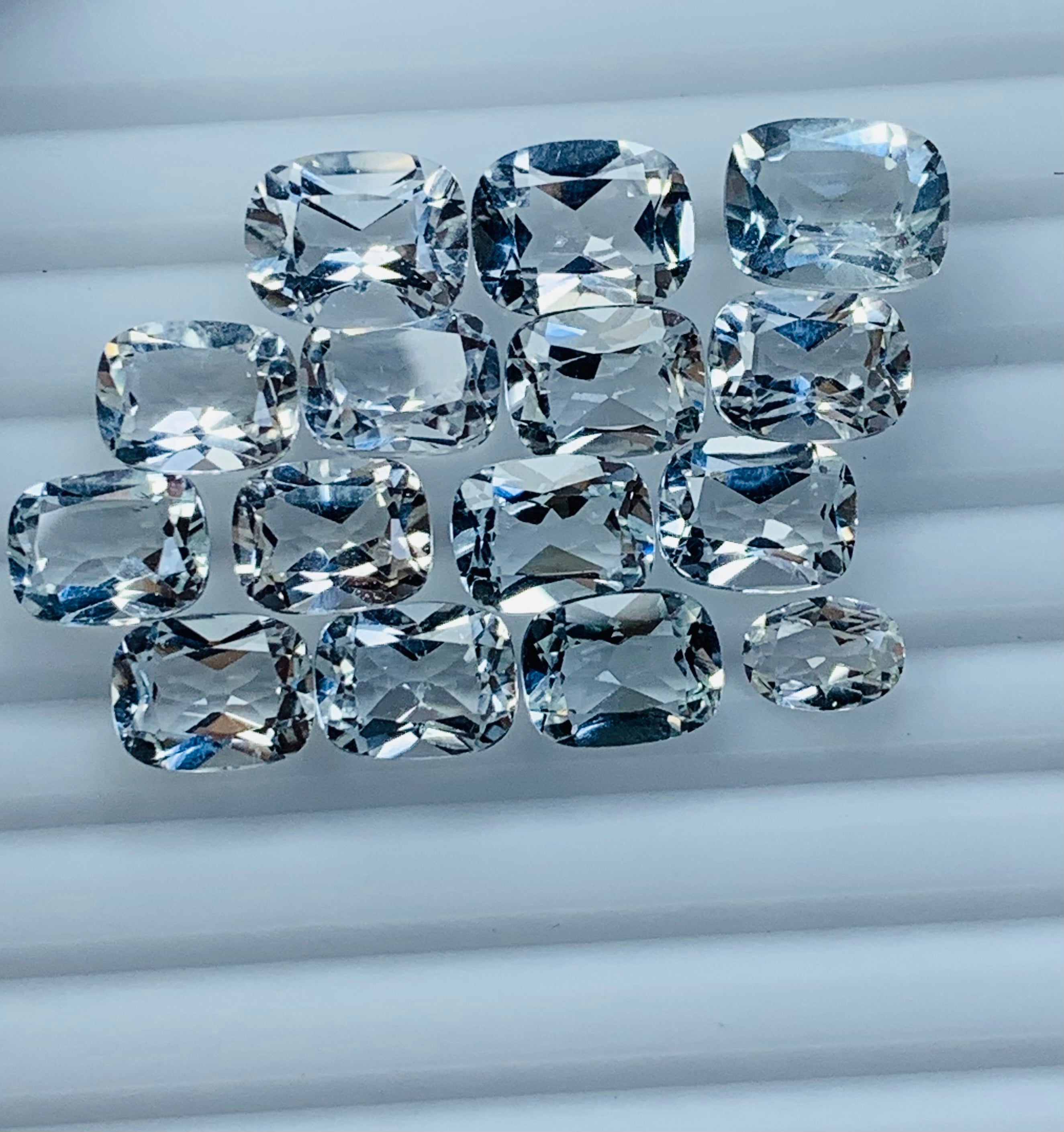 white tapaz faceted gemstone
