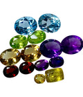 multi colored gemstones on a white background