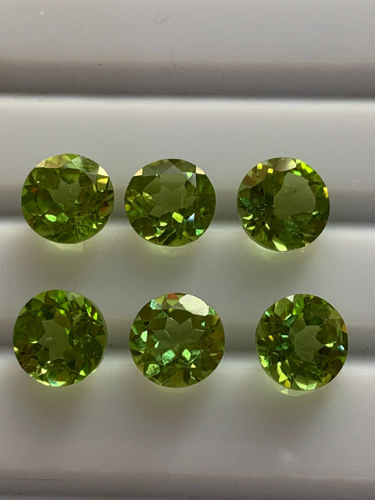 peridot huggie earrings