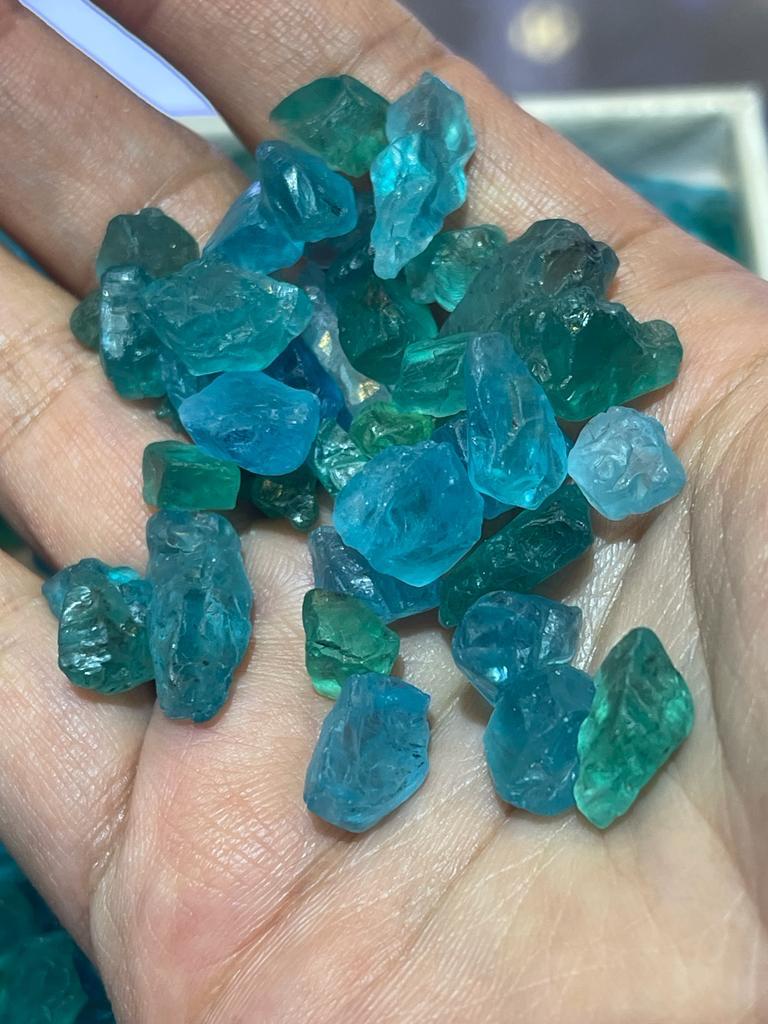 Raw apatite stones on a hand