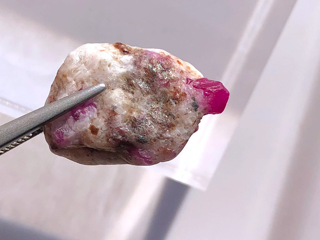 ruby inclusions visible on calcite matrix

